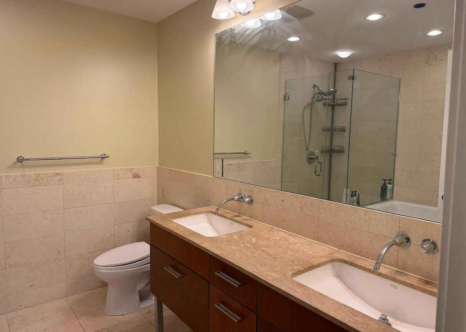 8125 River Road, Unit 3C North Bergen, NJ 07047 - Photo 15 of 23 a bathroom with a granite countertop sink a toilet and a mirror