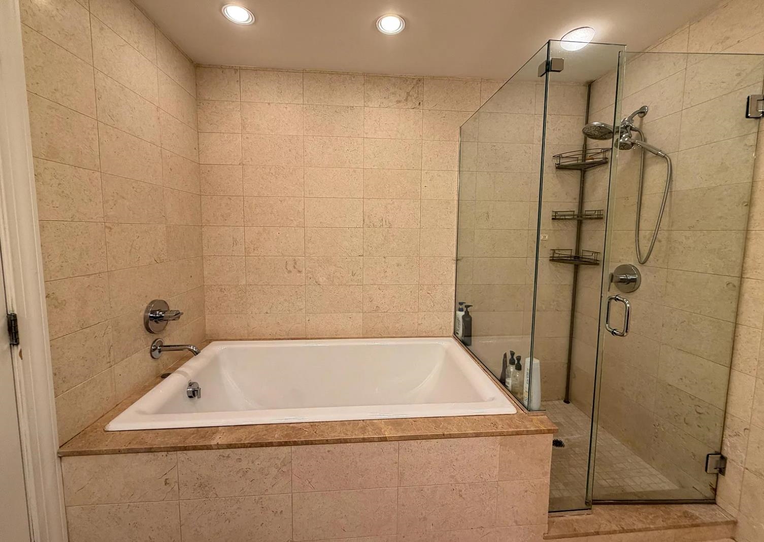 8125 River Road, Unit 3C North Bergen, NJ 07047 - Photo 16 of 23 a bathroom with a white bath tub and shower