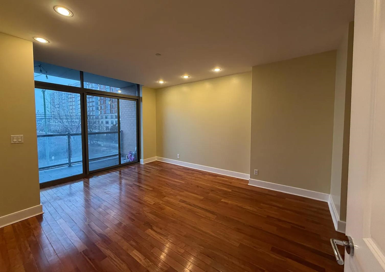 8125 River Road, Unit 3C North Bergen, NJ 07047 - Photo 7 of 23 a view of an empty room with wooden floor and a window