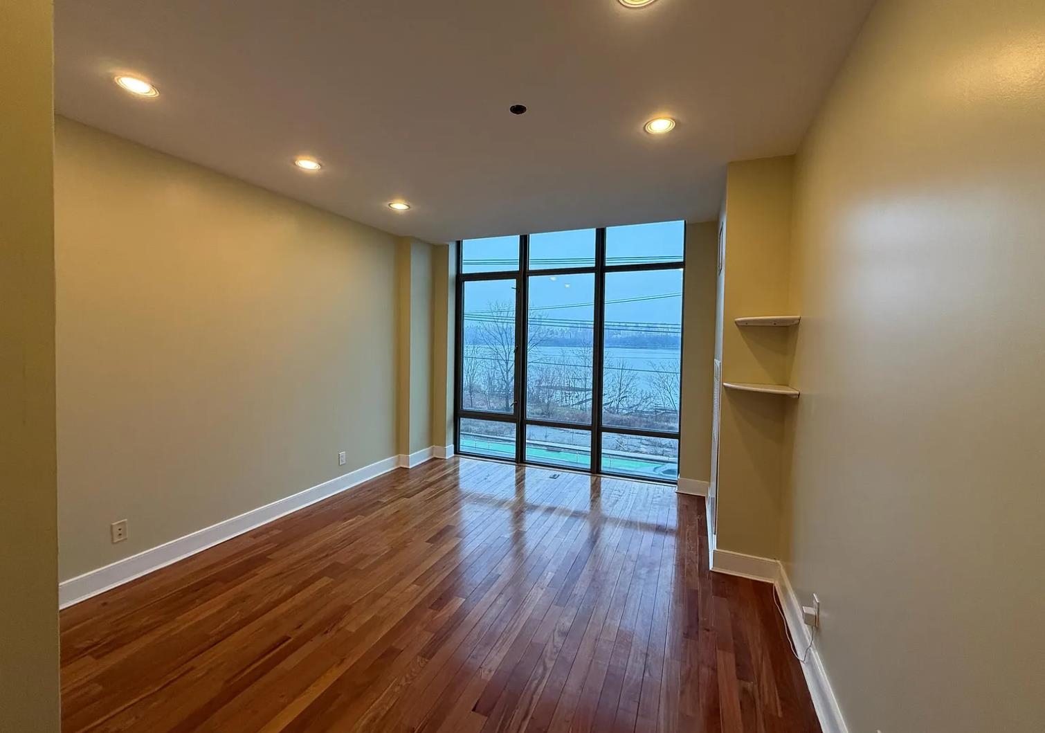 8125 River Road, Unit 3C North Bergen, NJ 07047 - Photo 9 of 23 a view of empty room with wooden floor