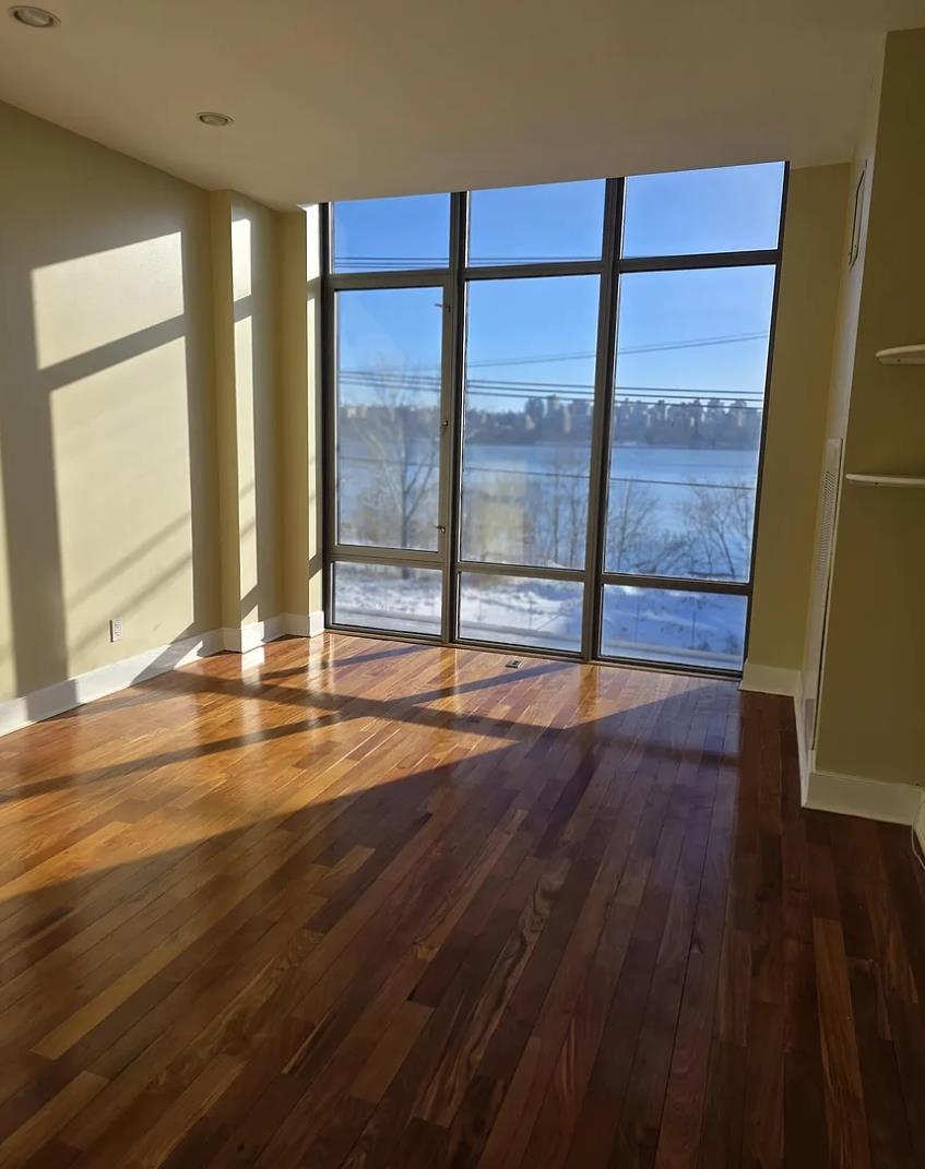 8125 River Road, Unit 3C North Bergen, NJ 07047 - Photo 10 of 23 a view of an empty room with wooden floor and a window