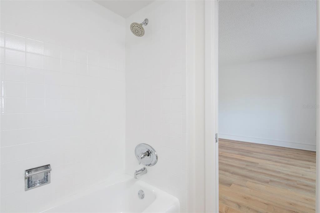4725 Cove Circle, Unit 207 St. Petersburg, FL 33708 - Photo 14 of 46 a bathroom with a bathtub