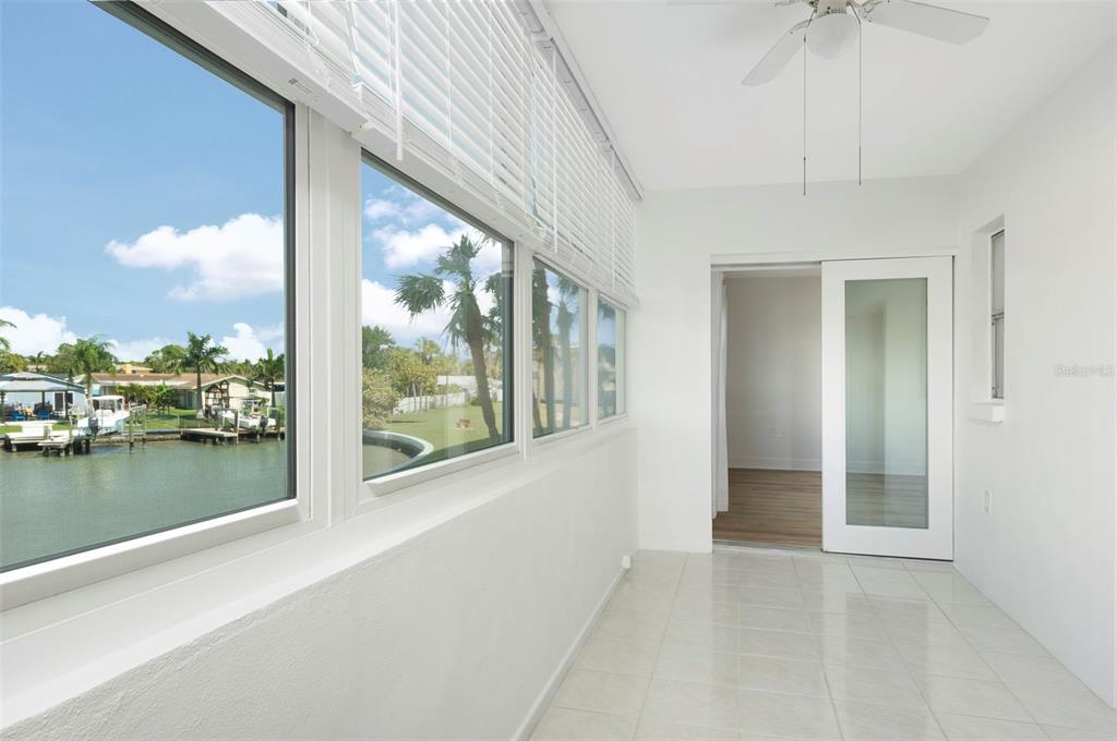 4725 Cove Circle, Unit 207 St. Petersburg, FL 33708 - Photo 18 of 46 a view of a lake from a windows