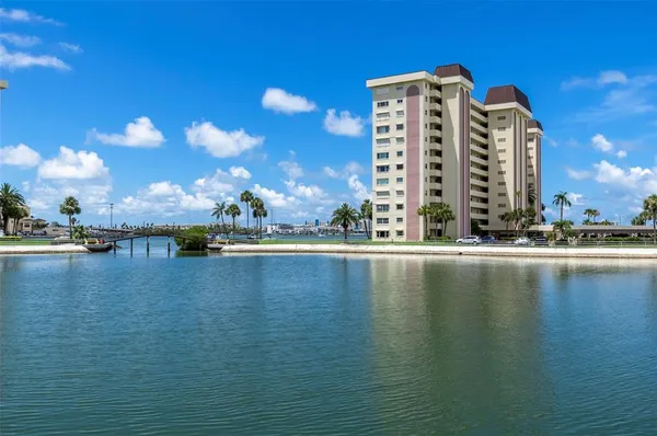 a view of a lake with tall building