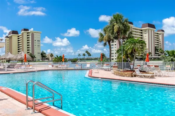 a view of swimming pool and outdoor seating