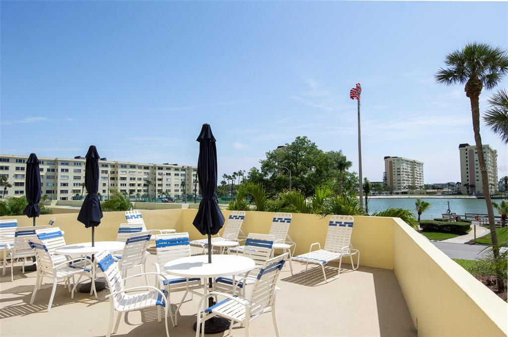 4725 Cove Circle, Unit 207 St. Petersburg, FL 33708 - Photo 40 of 46 a view of a terrace with furniture