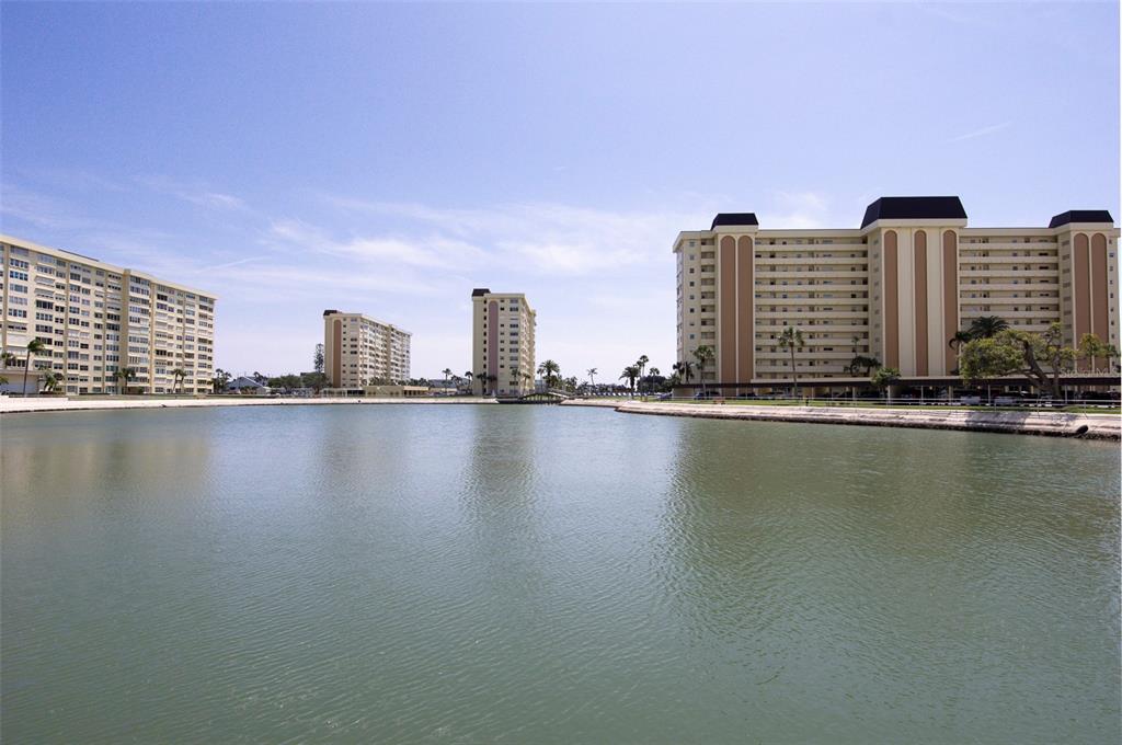 4725 Cove Circle, Unit 207 St. Petersburg, FL 33708 - Photo 45 of 46 a view of building and lake