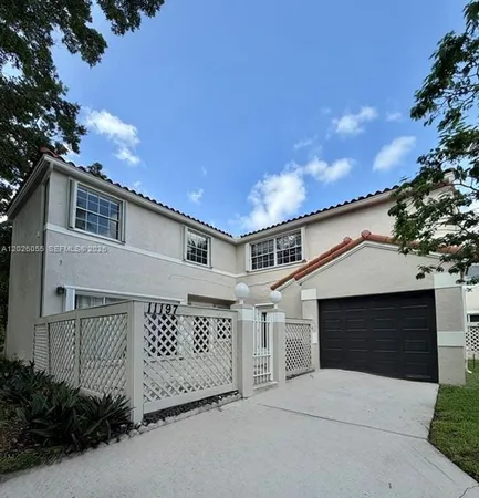 a front view of a house with a garage