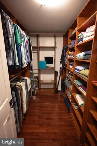 a bathroom with a sink a mirror a vanity and a window