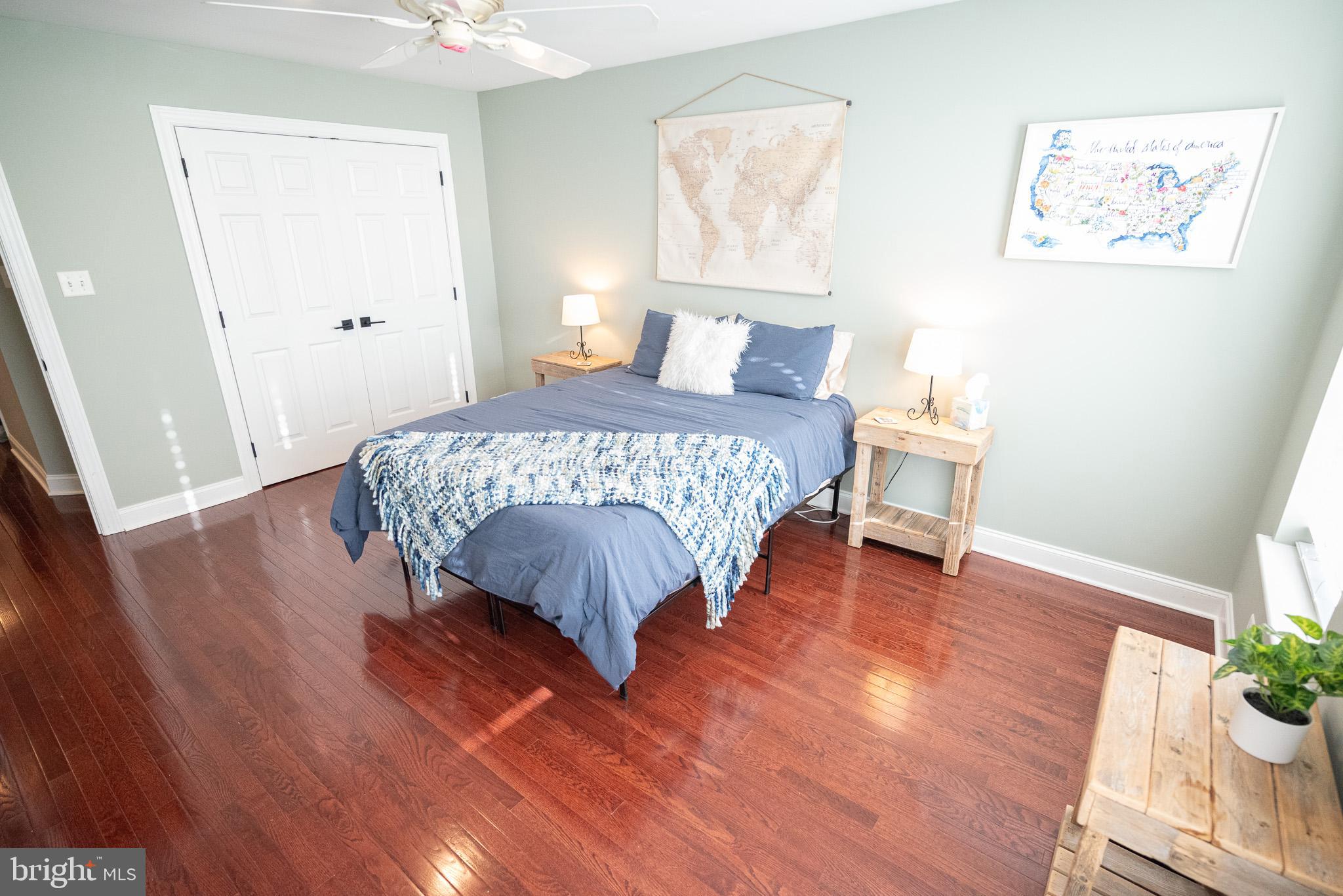210 Spring Lane West Chester, PA 19382 - Photo 30 of 49 a bedroom with a bed and a potted plant