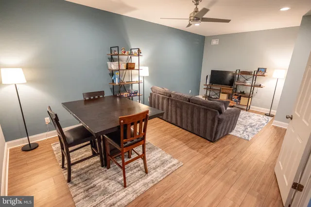 a living room with furniture and a rug