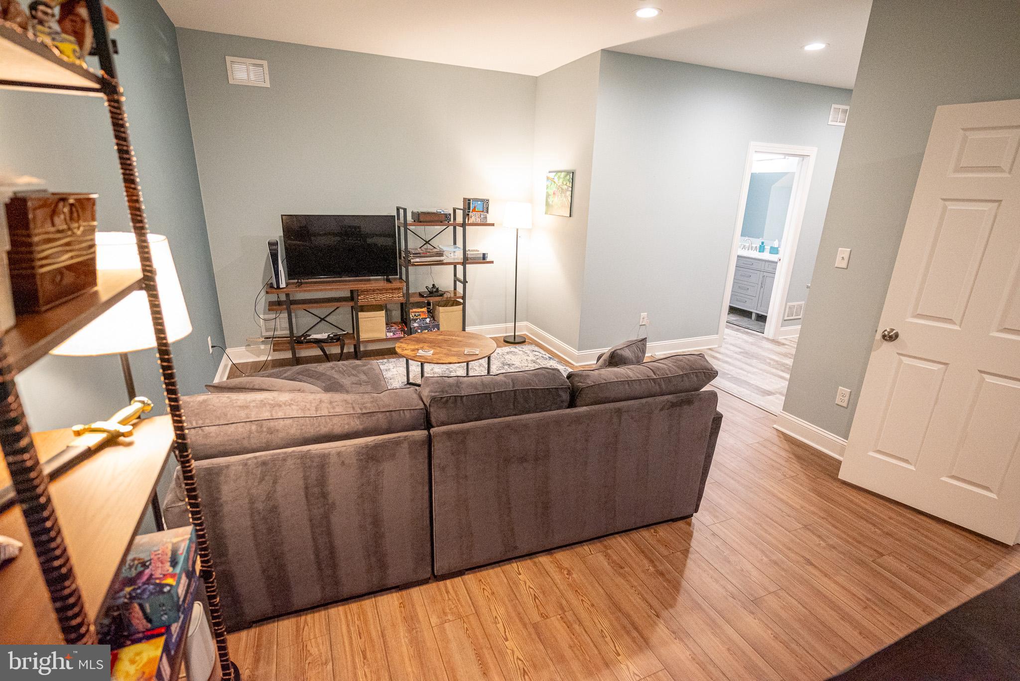 210 Spring Lane West Chester, PA 19382 - Photo 34 of 49 a living room with furniture and a flat screen tv