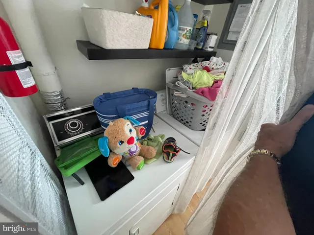 a balcony with furniture and a potted plant