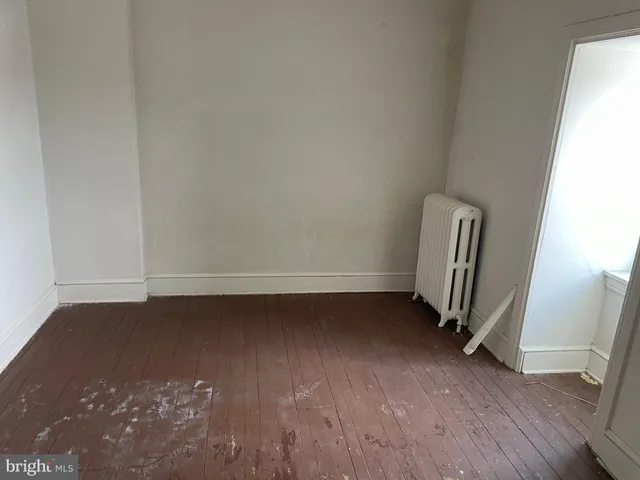 a room with furniture and wooden floor