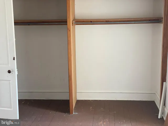 a bathroom with a toilet and a window