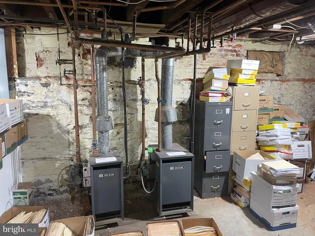 a view of a patio with a table and chairs