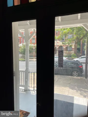 a kitchen with stainless steel appliances sink refrigerator and window