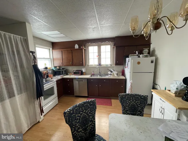 a view of living room with furniture and a window