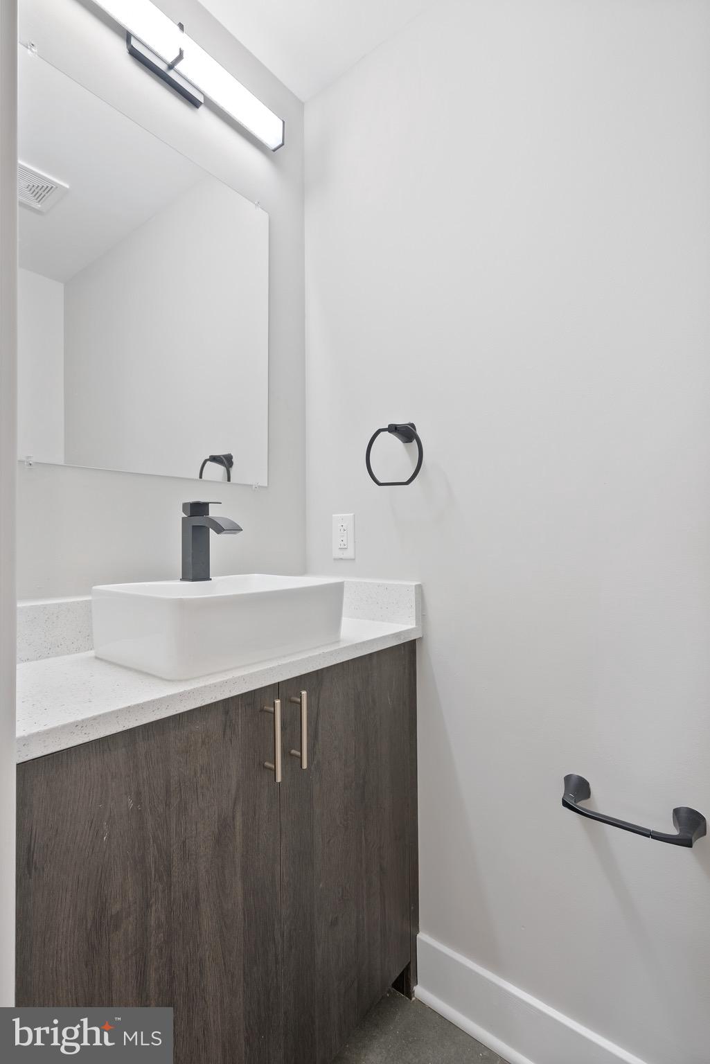 408-10 North Front Street, Unit 2 Philadelphia, PA 19123 - Photo 6 of 15 a bathroom with a sink and a mirror