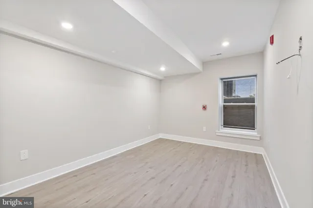 a view of wooden floor in an empty room