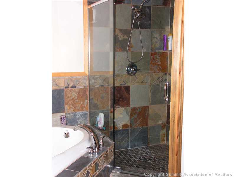 1610 Redhill Road Fairplay, CO 80440 - Photo 12 of 25 Master Bath/Spa. Slate walk-in shower and slate surrounded spa tub.