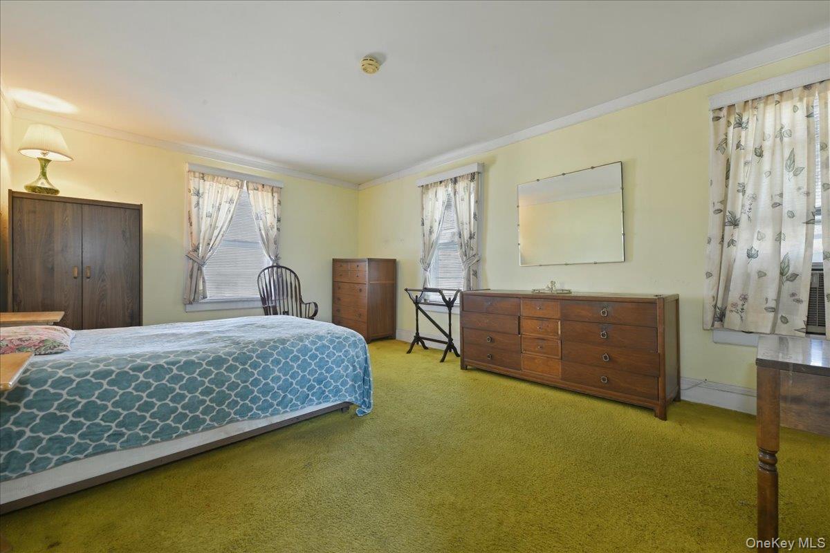 590 Waterview Road Oceanside, NY 11572 - Photo 12 of 26 a bedroom with a bed and window