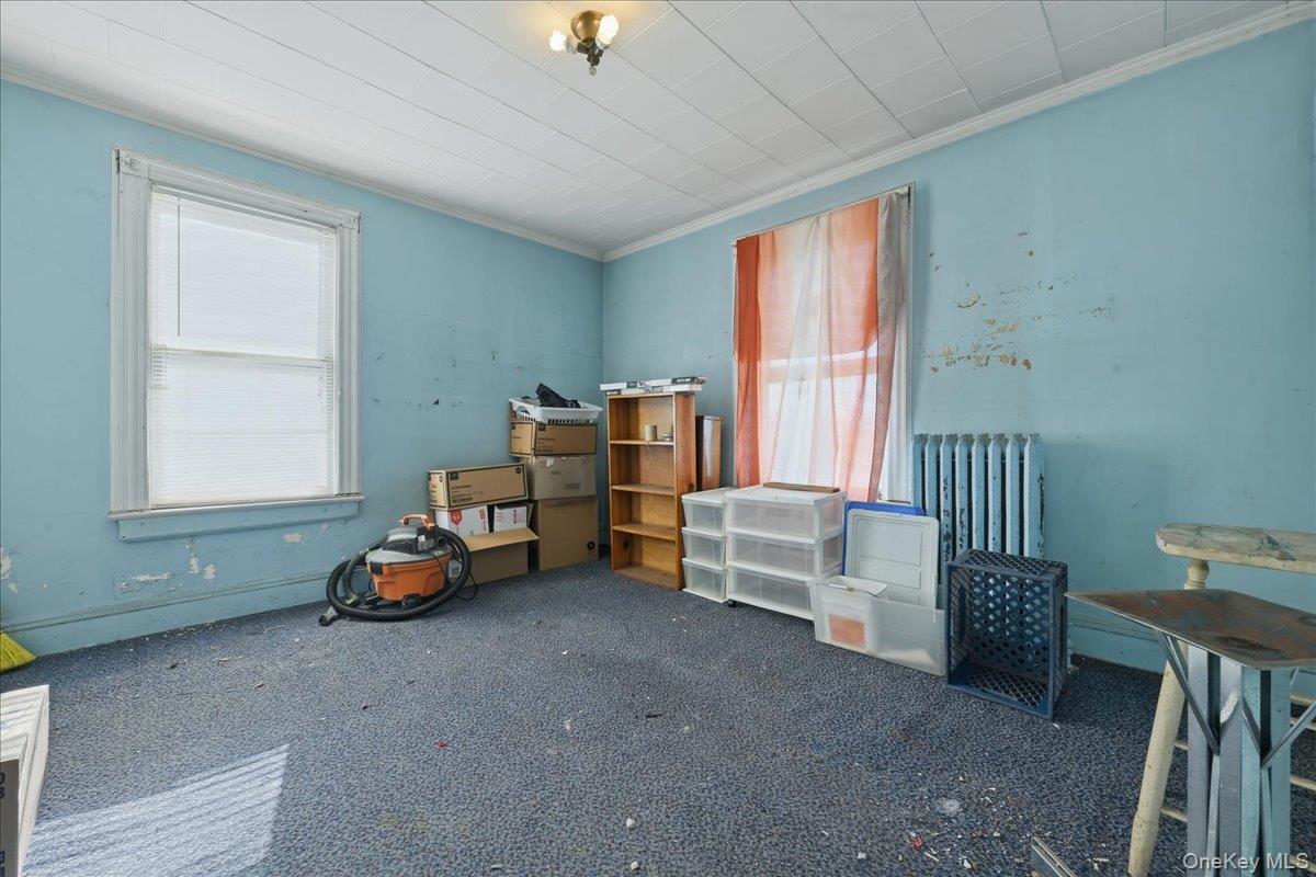 590 Waterview Road Oceanside, NY 11572 - Photo 15 of 26 a bedroom with furniture and a window