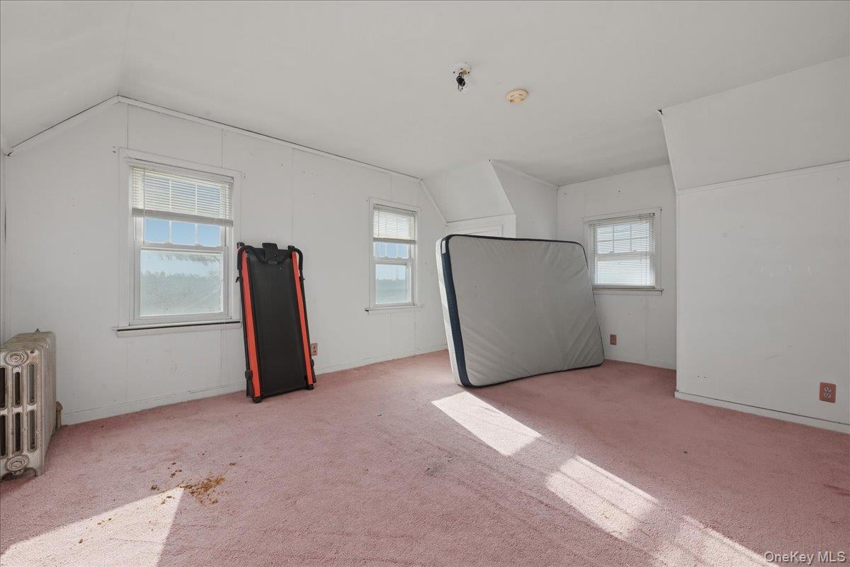 590 Waterview Road Oceanside, NY 11572 - Photo 17 of 26 a view of a room with closet and a window
