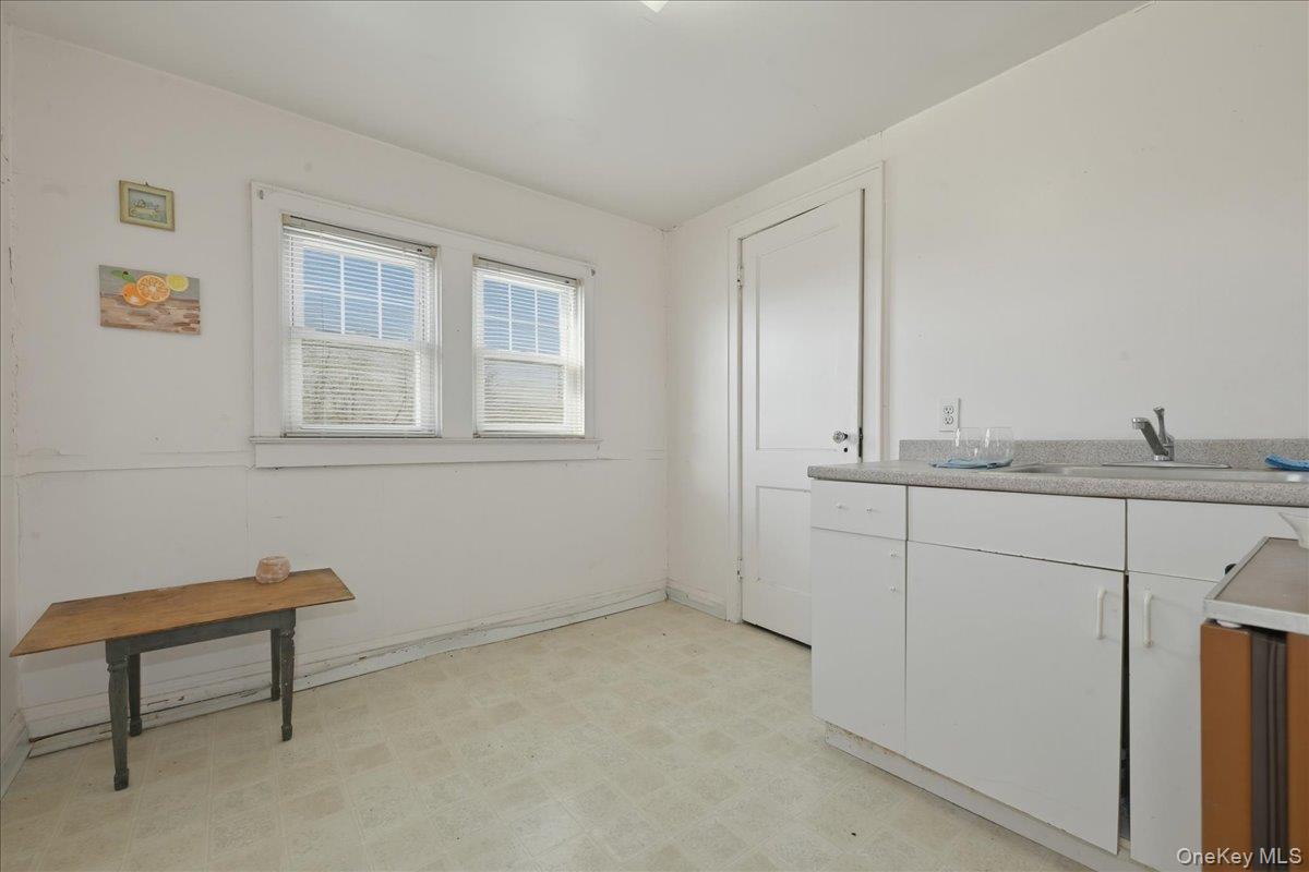 590 Waterview Road Oceanside, NY 11572 - Photo 18 of 26 a bathroom with a sink and a window