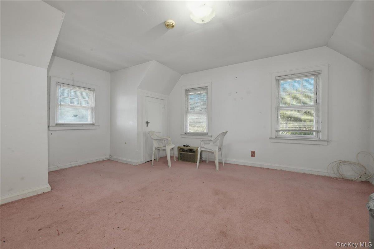 590 Waterview Road Oceanside, NY 11572 - Photo 19 of 26 an empty room with windows and closet