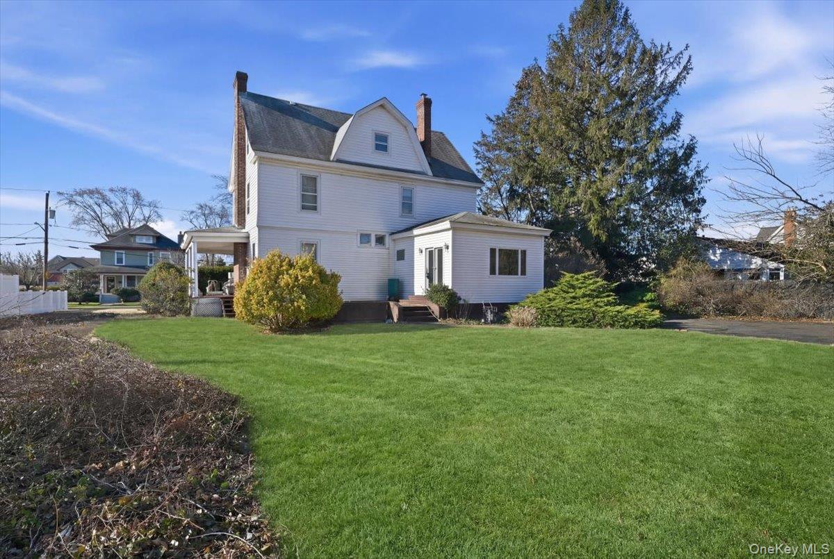 590 Waterview Road Oceanside, NY 11572 - Photo 23 of 26 a front view of a house with garden