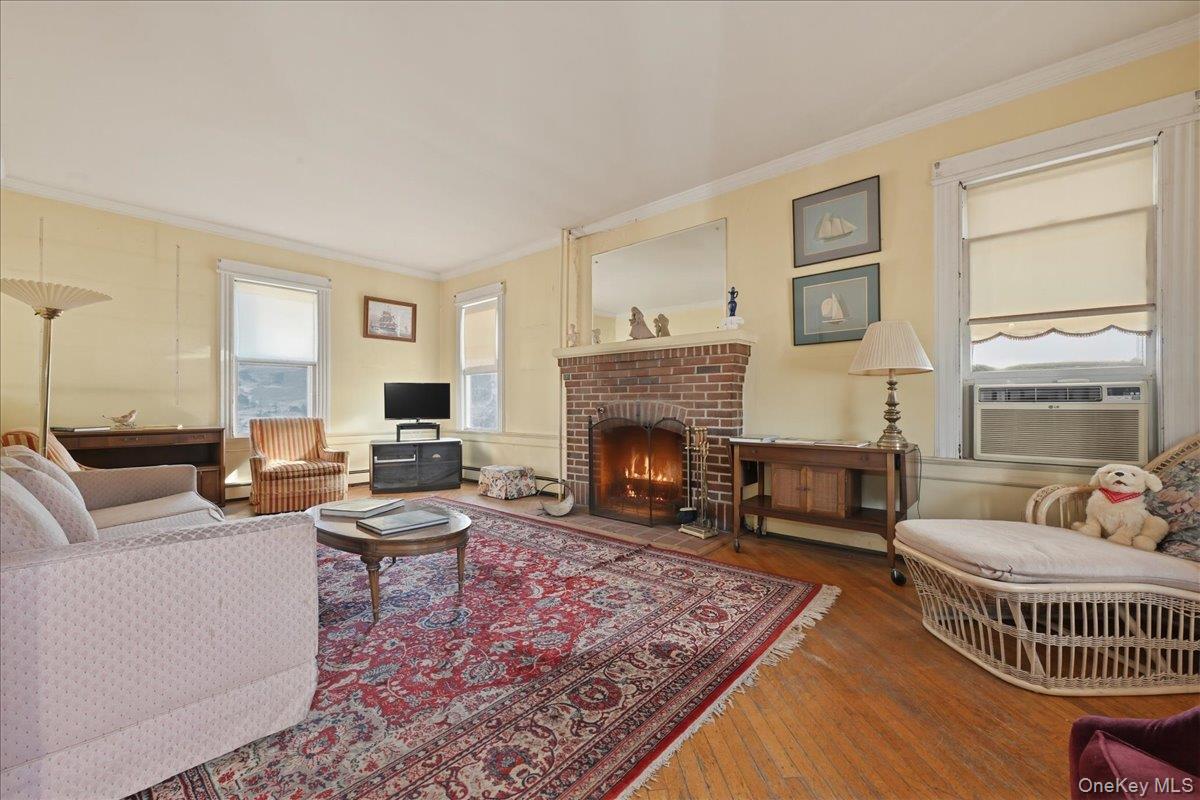 590 Waterview Road Oceanside, NY 11572 - Photo 3 of 26 a living room with furniture and a fireplace