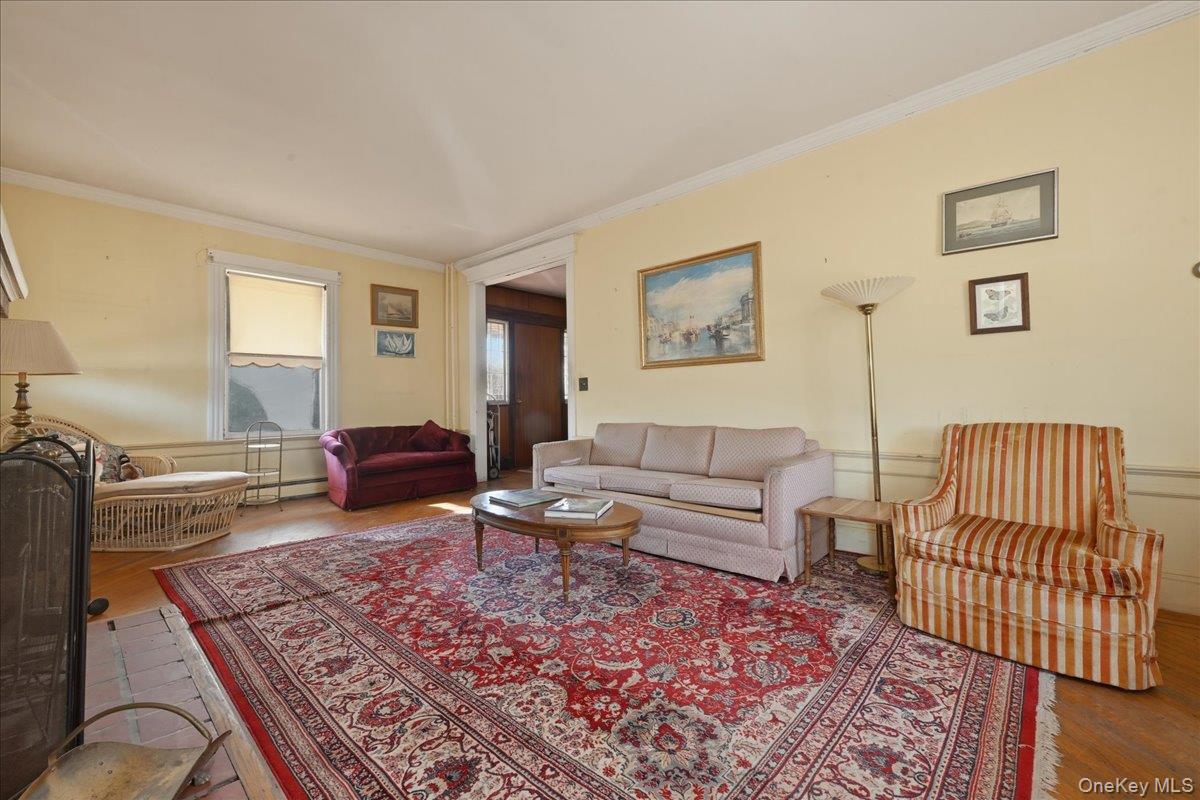 590 Waterview Road Oceanside, NY 11572 - Photo 4 of 26 a living room with furniture or couch and a wooden floor