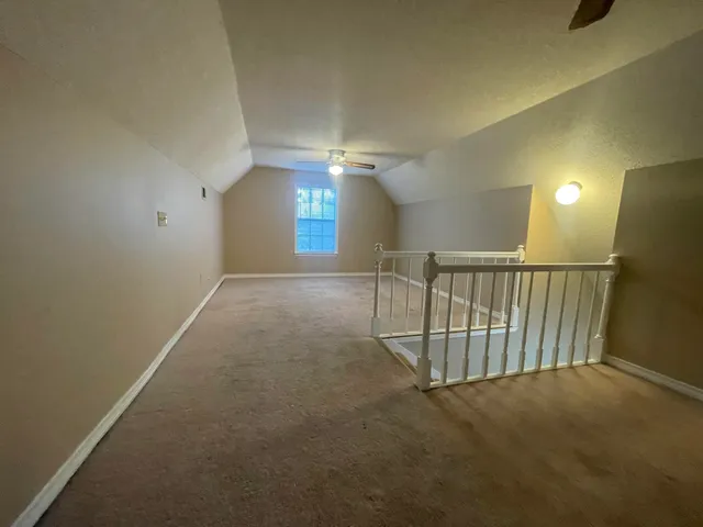 a view of entryway and hall with a window