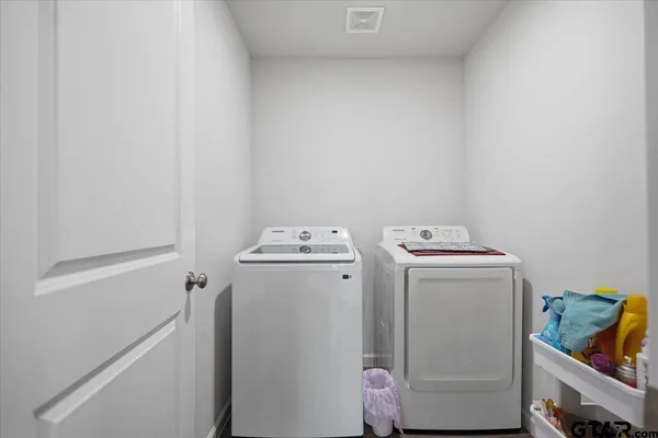 a utility room with dryer and washer