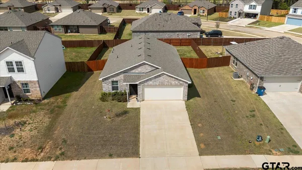 an aerial view of a house with swimming pool