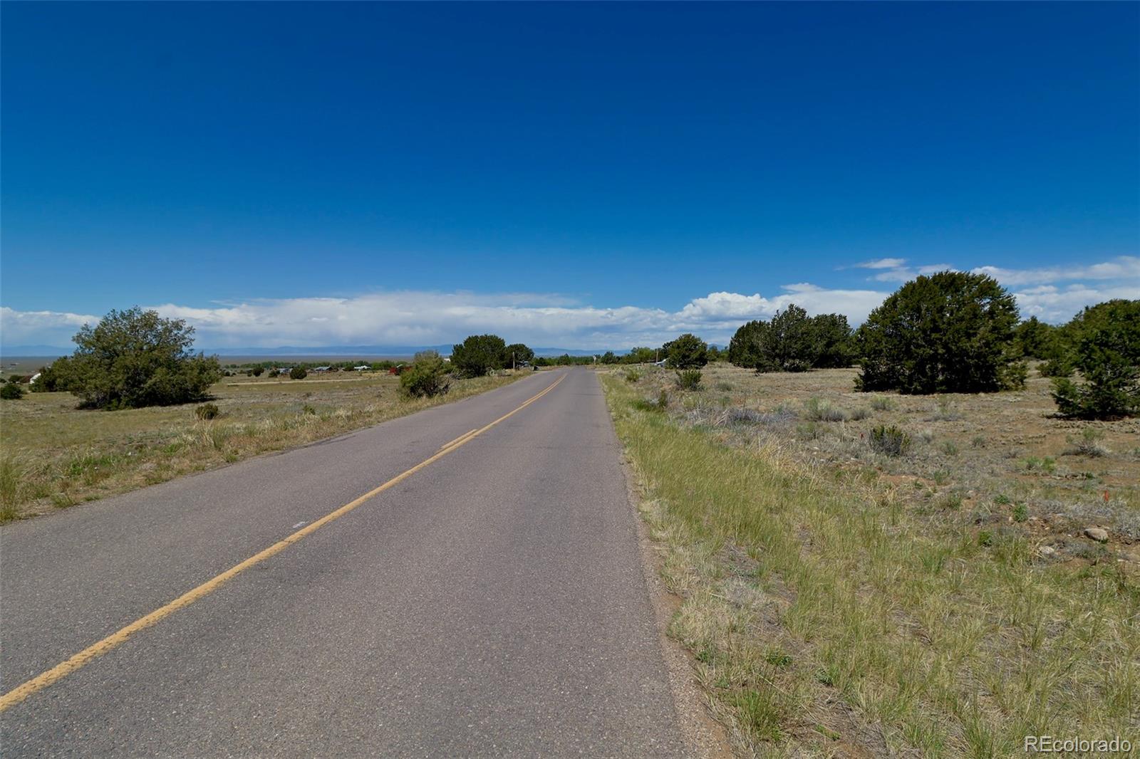 1515 Wagon Wheel Road Crestone, CO 81131 - Photo 15 of 15 a view of a road with a yard