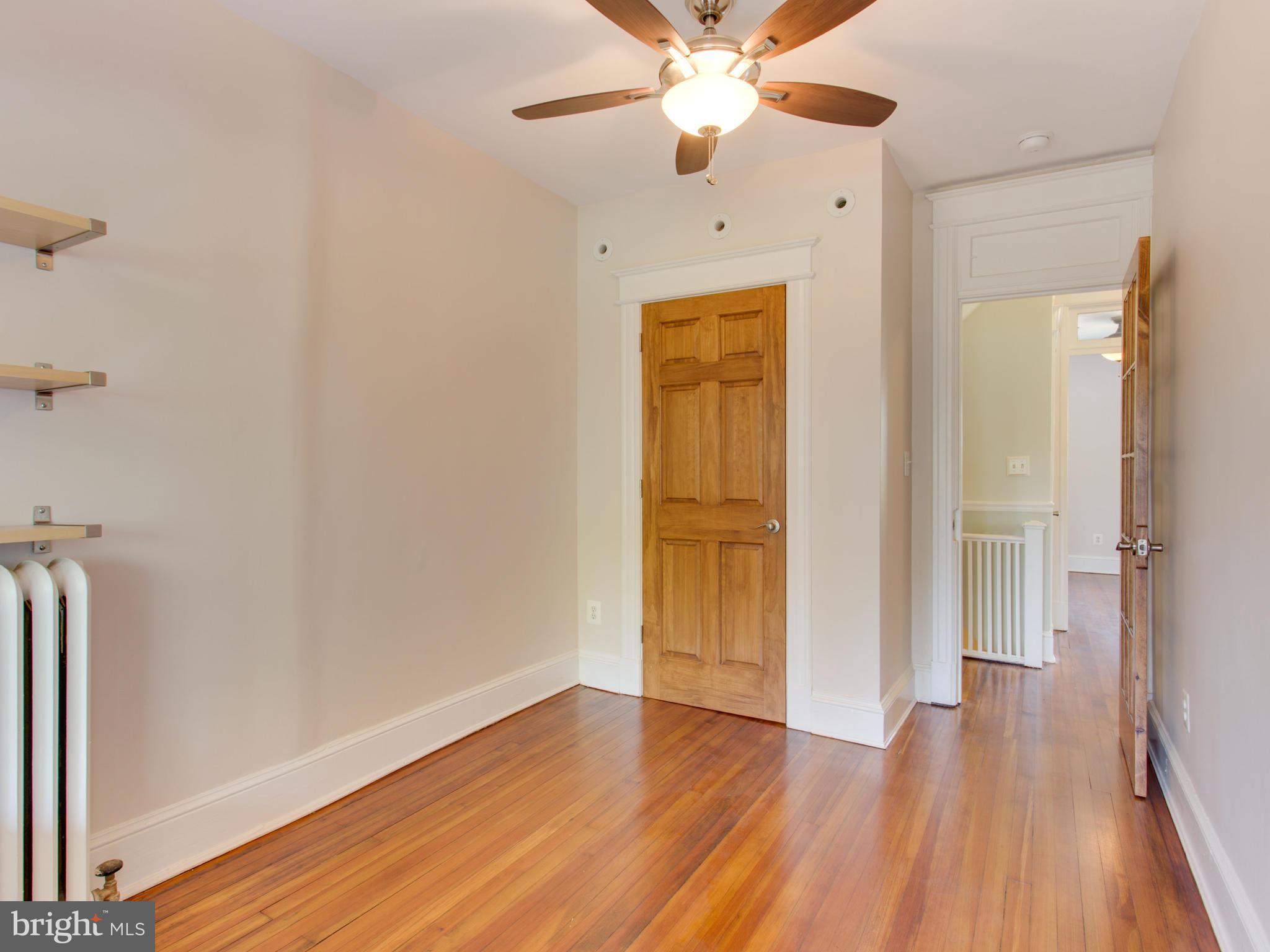 408 Rittenhouse Street Northwest Washington, DC 20011 - Photo 15 of 30 wooden floor in an empty room with a window