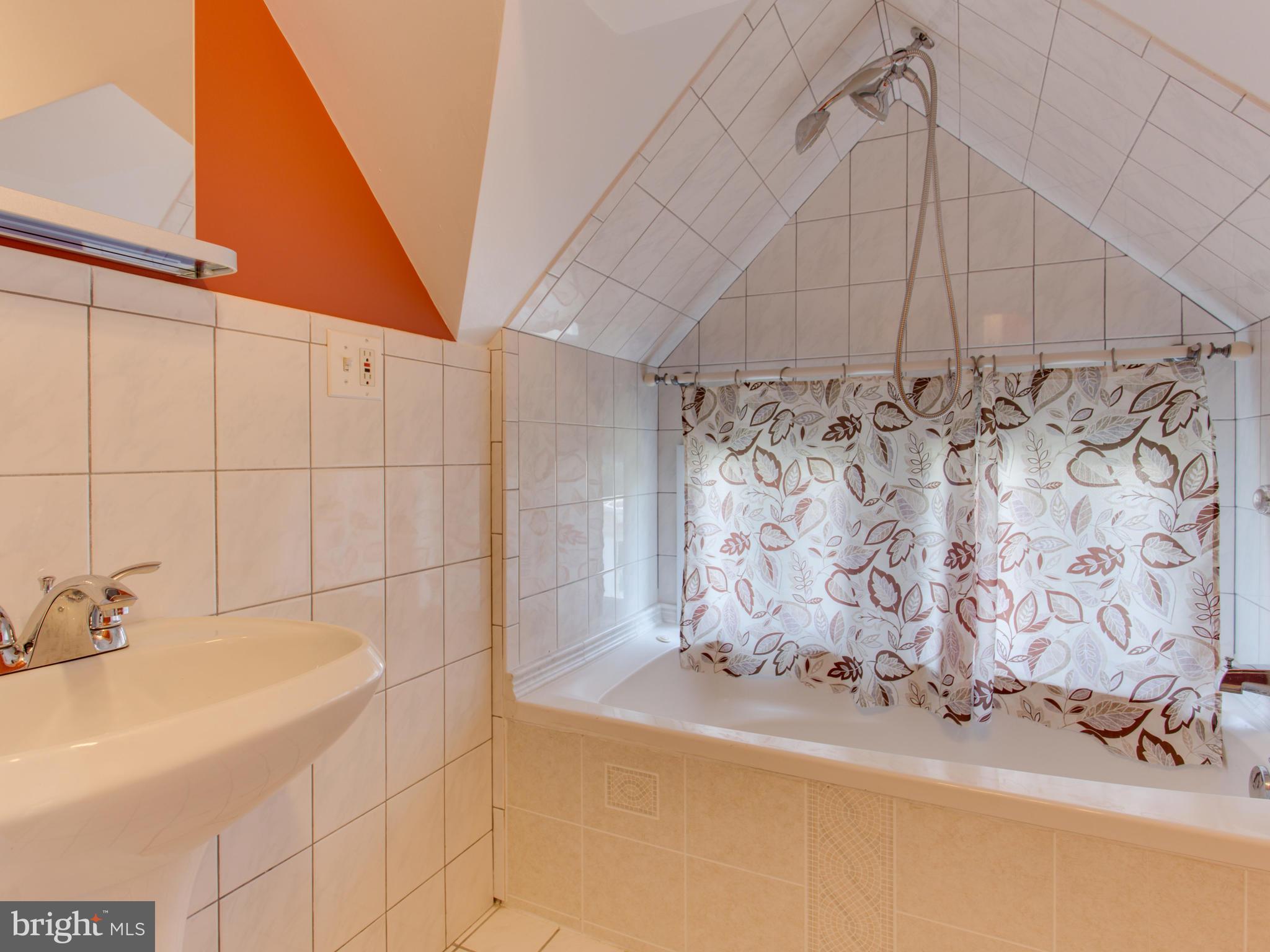 408 Rittenhouse Street Northwest Washington, DC 20011 - Photo 21 of 30 a bathroom with a bathtub and shower