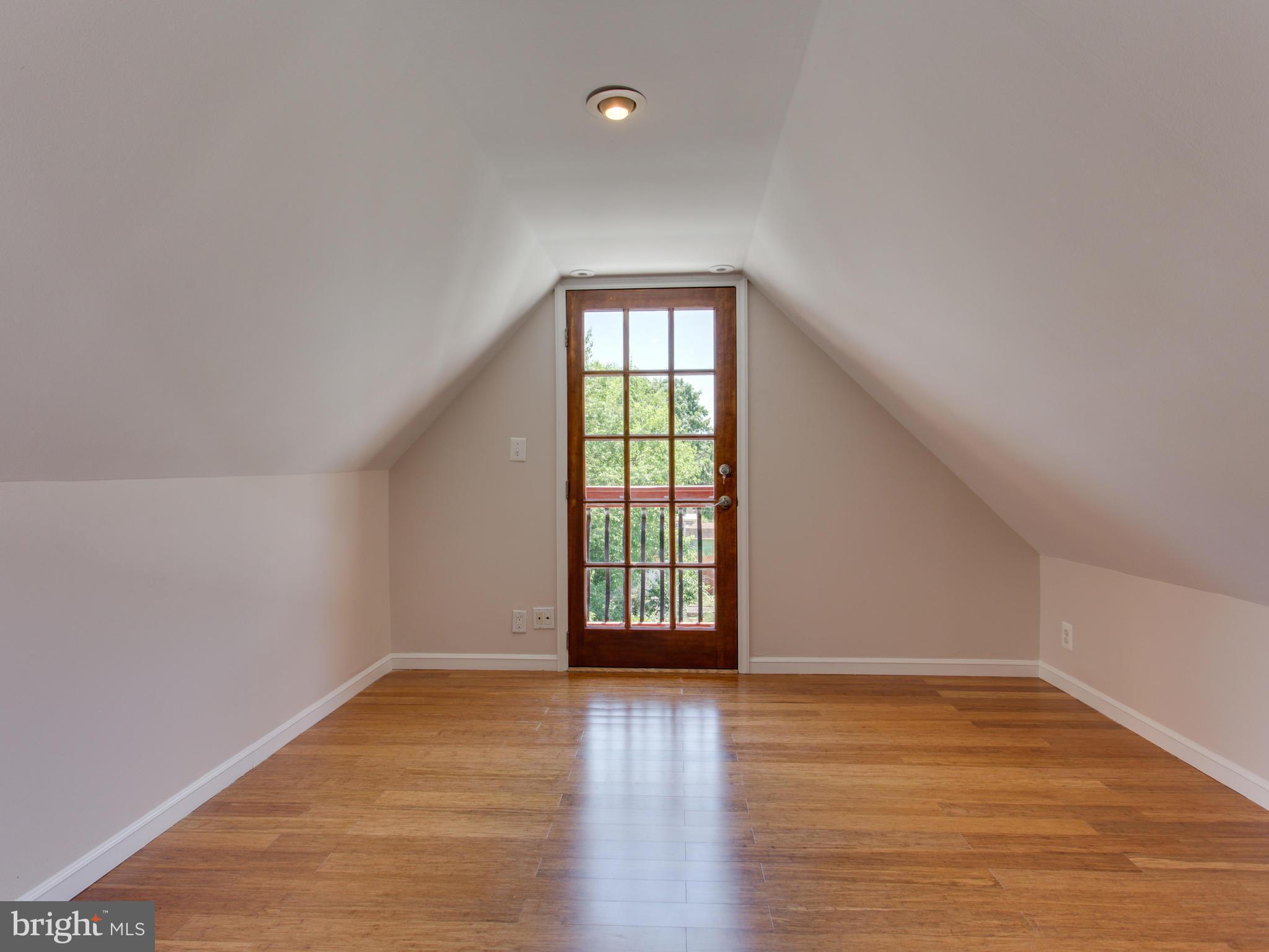 408 Rittenhouse Street Northwest Washington, DC 20011 - Photo 22 of 30 wooden floor in an empty room with a window