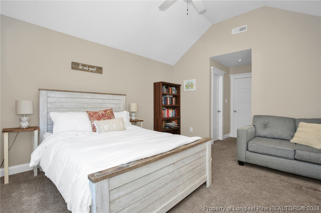 43 Shellnut Circle Spring Lake, NC 28390 - Photo 23 of 35 a bedroom with a bed and a couch