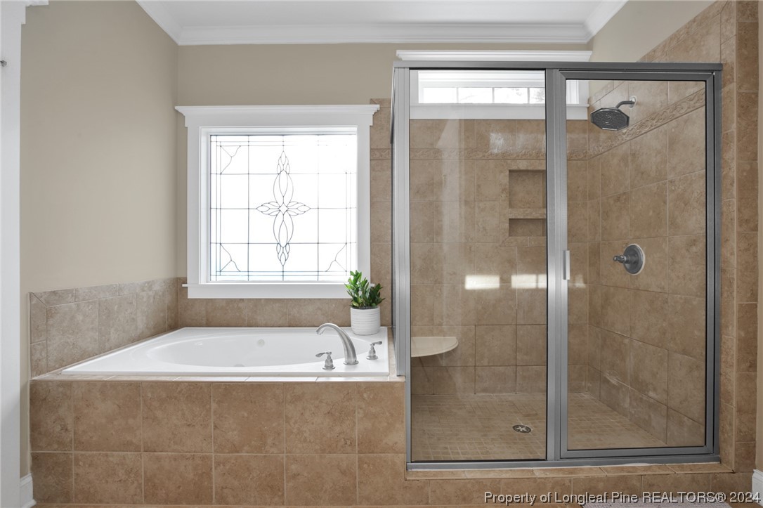 43 Shellnut Circle Spring Lake, NC 28390 - Photo 28 of 35 a bathroom with a bathtub and shower