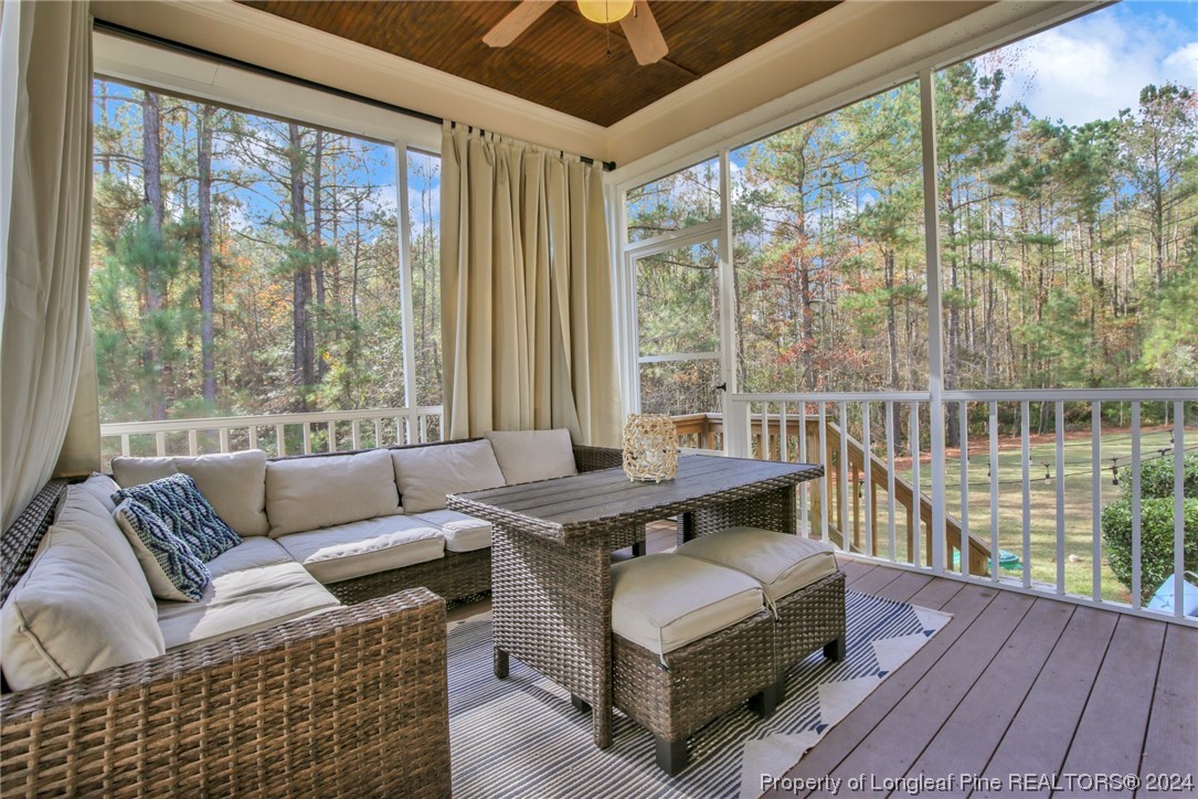 43 Shellnut Circle Spring Lake, NC 28390 - Photo 29 of 35 a living room with furniture and a floor to ceiling window