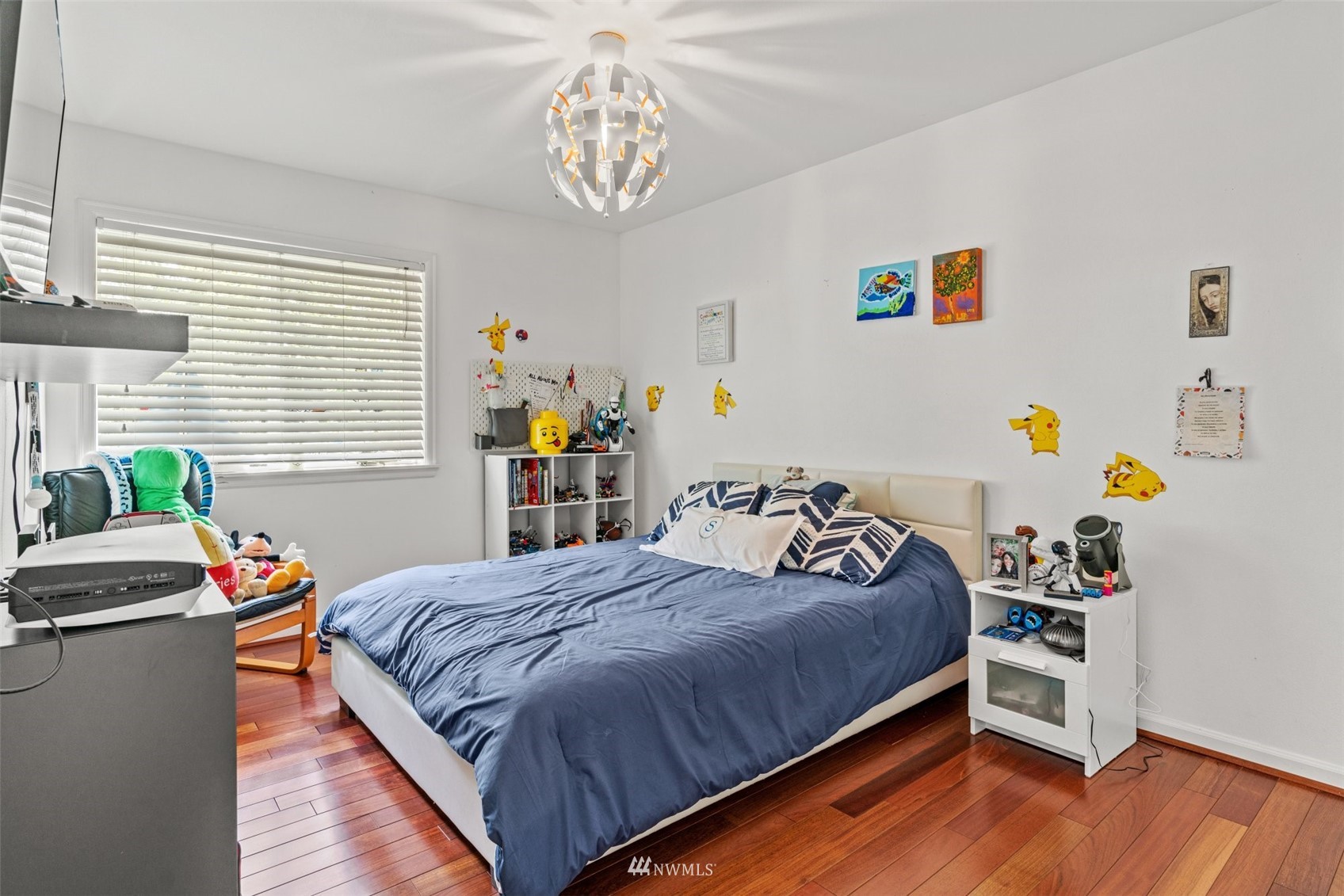 805 South 34th Place Renton, WA 98055 - Photo 19 of 36 a bedroom with a bed and a wooden floor