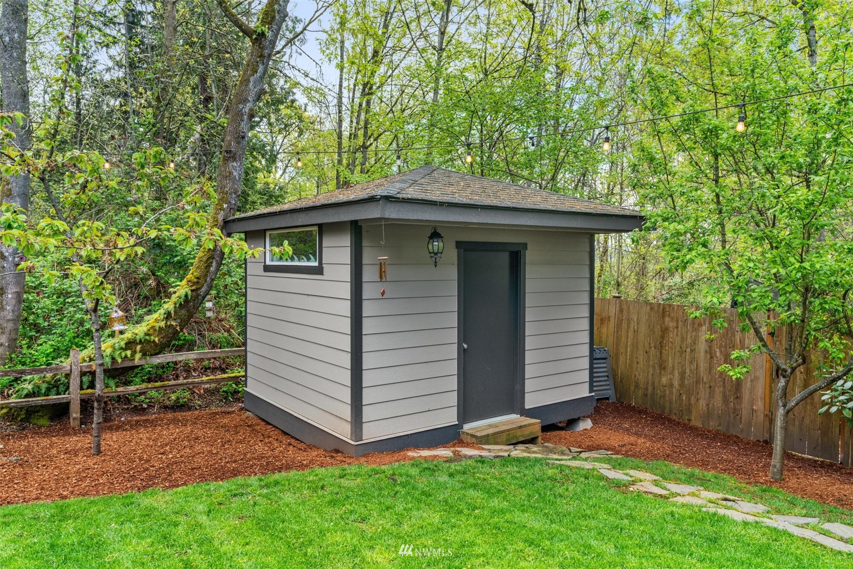 805 South 34th Place Renton, WA 98055 - Photo 29 of 36 a view of a backyard with plants and large tree