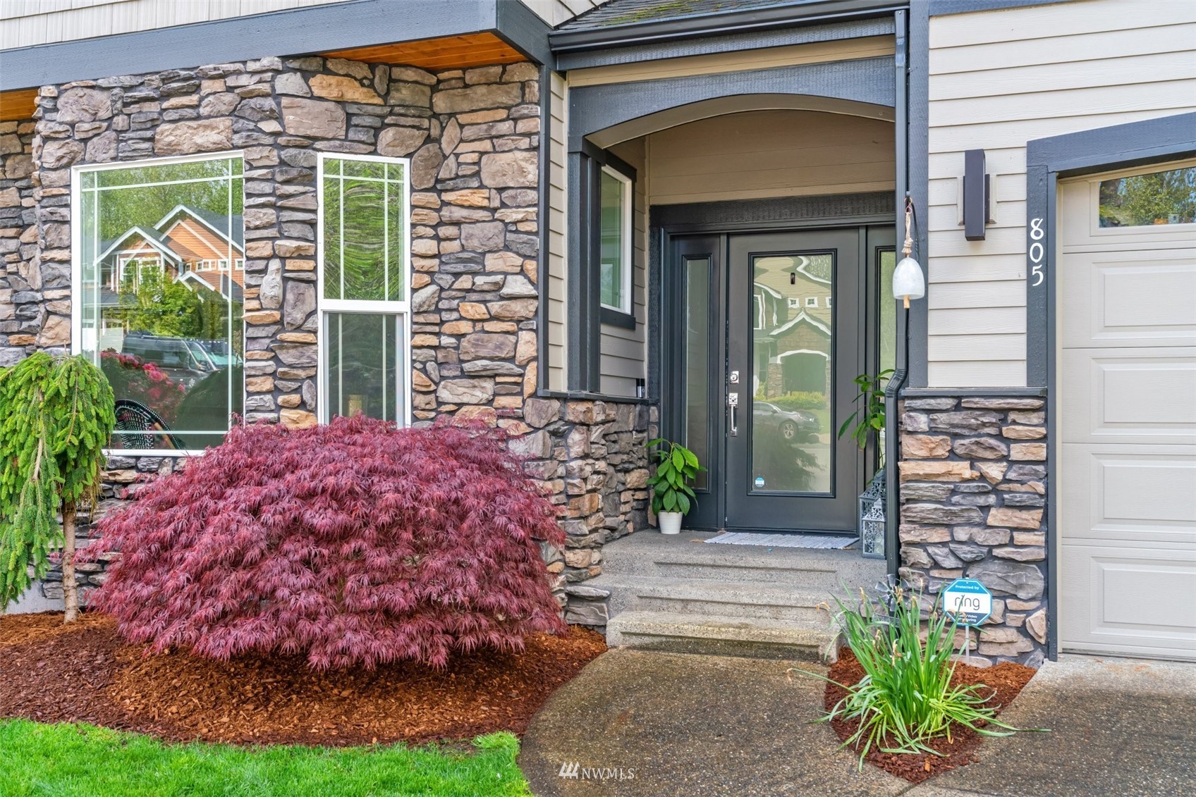 805 South 34th Place Renton, WA 98055 - Photo 3 of 36 a front view of a house with a garden