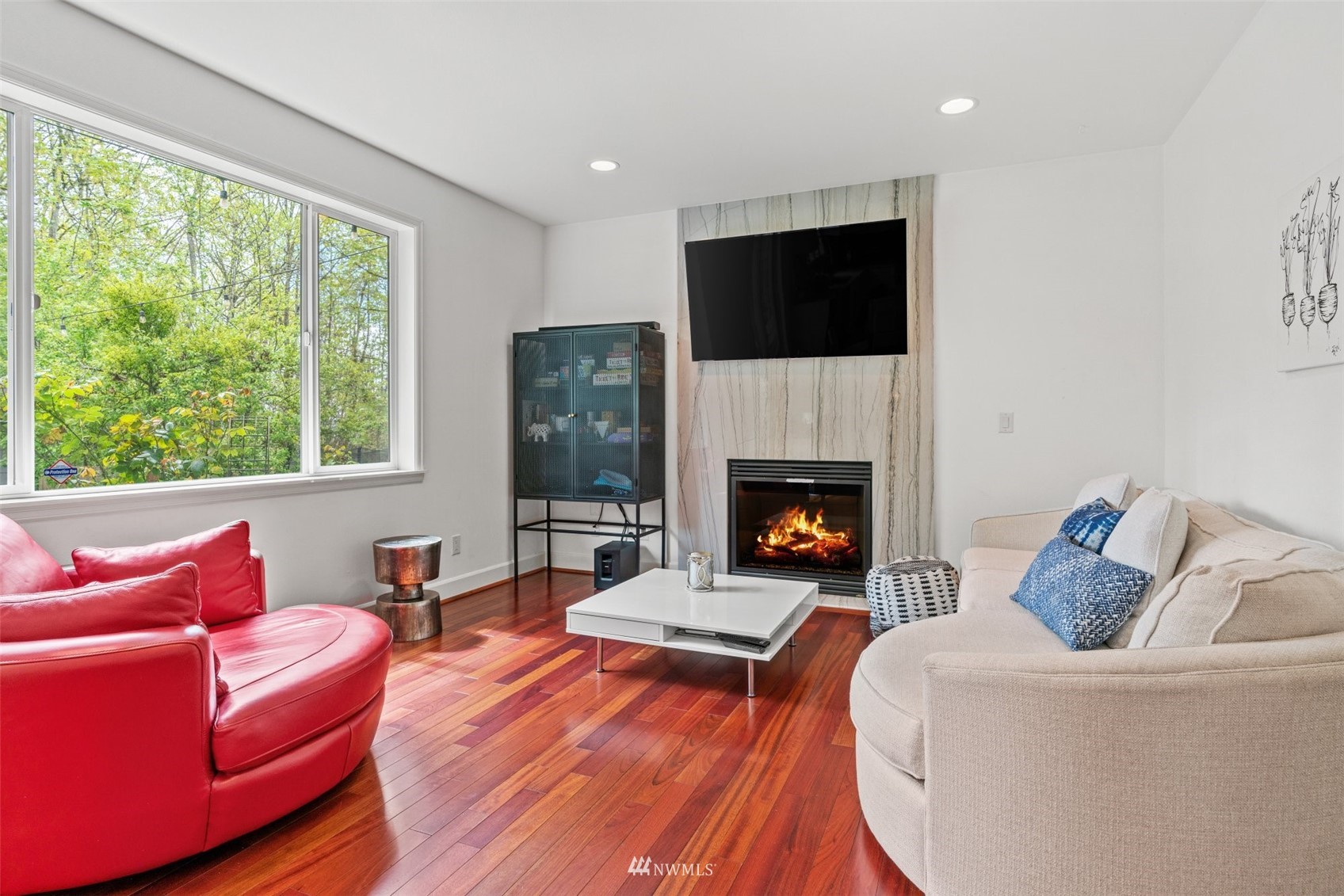 805 South 34th Place Renton, WA 98055 - Photo 7 of 36 a living room with furniture fireplace and window