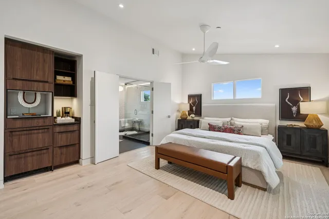 a bedroom with a bed and a dresser