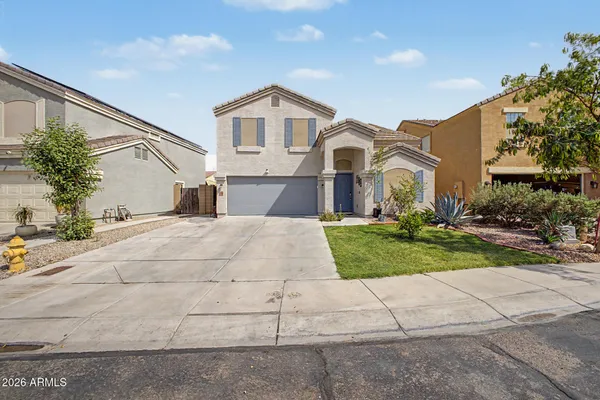 a view of house with yard