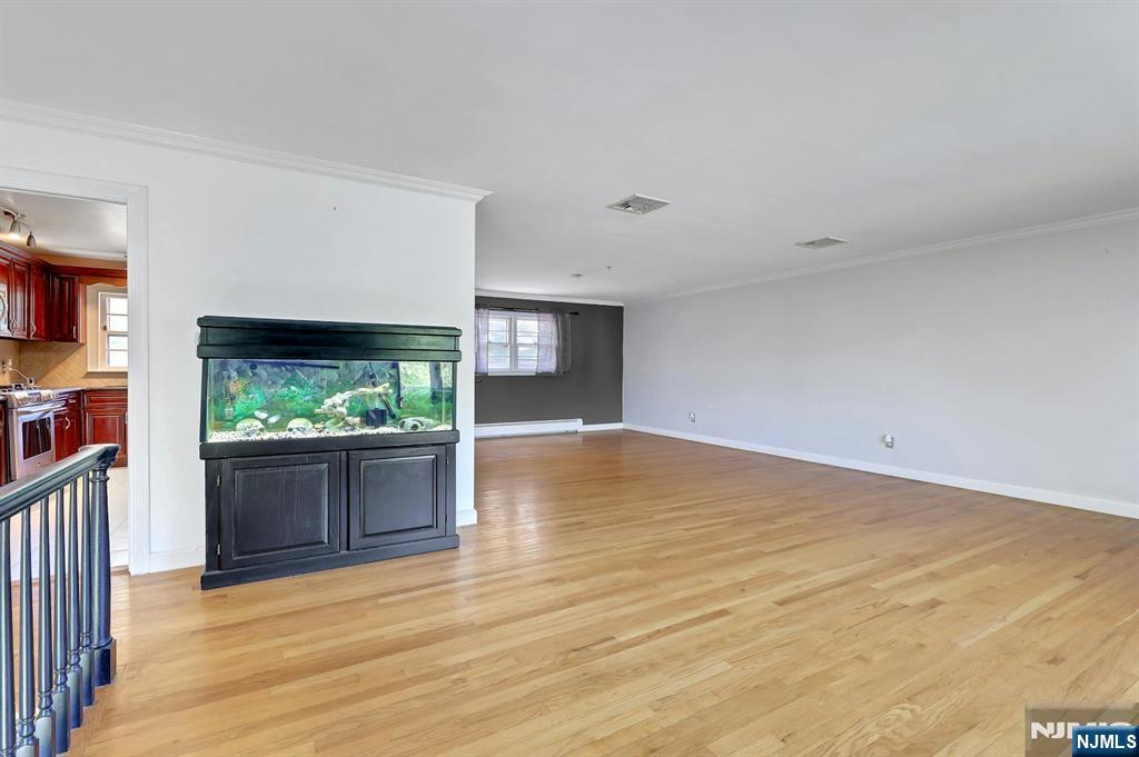 20 Blue Hill Road Norwood, NJ 07648 - Photo 6 of 49 a view of empty room with wooden floor and fan